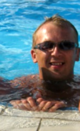 A happy cleaner in the corner of the pool.